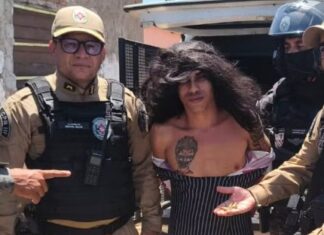 Suspeito de homicídios é preso disfarçado de mulher com criança no colo